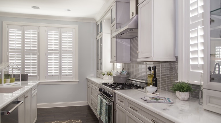 Polywood shutters in Cleveland kitchen with marble counter.
